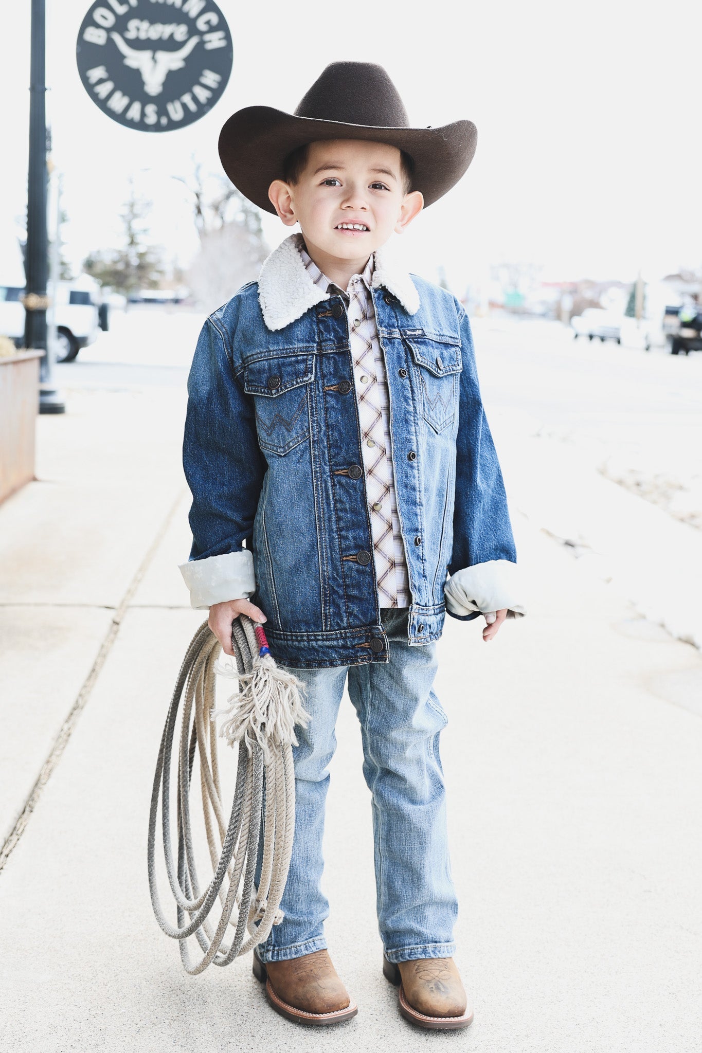 Collection of kids western apparel found at Bolt Ranch Store. stylish clothing for boys, girls, toddlers, and babies, all with a charming western flair. From rugged denim t cowboy hats, girls dresses and boots for everyone.