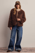 Listicle Shaggy Faux Fur Jacket layered over a knit top with wide leg denim for cold weather ranch wear Kamas