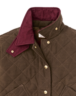 Filson Womens Quilted Outfitter Jacket Dark Brown brown heritage jacket styled with denim and boots for ranch and town Kamas