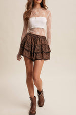 Listicle Sheer Lace Long Sleeve Top Ecru paired with a tiered mini skirt and cowboy boots for rodeo season