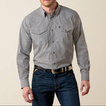 A man wearing a long-sleeve button-down western shirt with a small black and white gingham pattern plaid shirt mens western 10079410 Ariat Mens WF Bud Classic Snap Shirt at boltranchstore.com in stock free shipping 