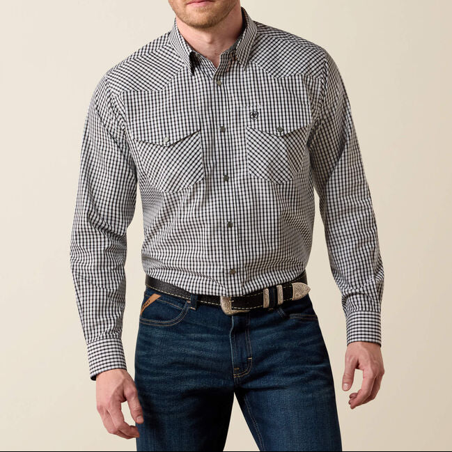 A man wearing a long-sleeve button-down western shirt with a small black and white gingham pattern plaid shirt mens western 10079410 Ariat Mens WF Bud Classic Snap Shirt at boltranchstore.com in stock free shipping 