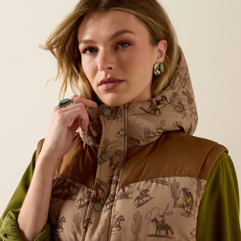 Ariat Frontier Puffer Vest Retro Rodeo Dachshund layered over denim and boots for ranch wear and everyday western fashion