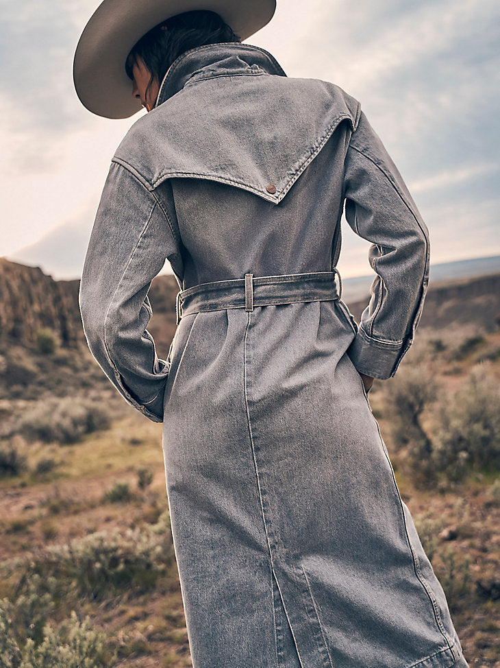 Wrangler Womens Denim Trench in Haute Haze features a denim trench coat, waist tie and stylish collar with back yoke, a perfect trench coat for warmth and style at the next rodeo.