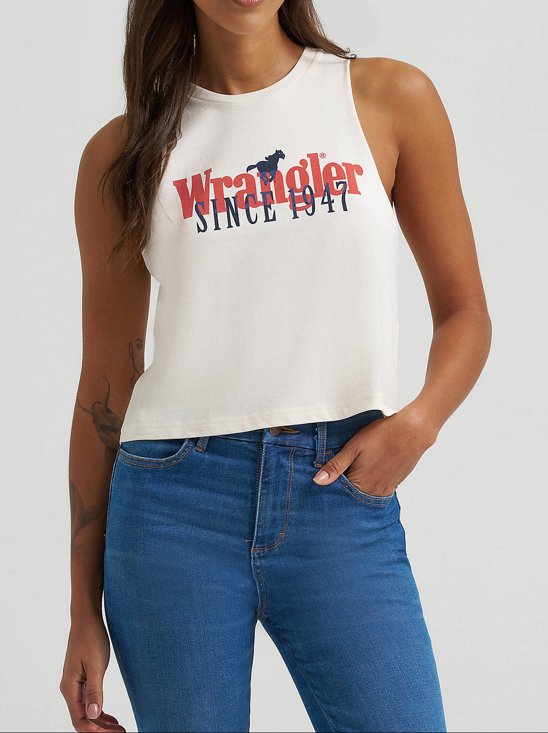 112375847 Wrangler Womens Fest Tank atboltranchstore.com with free shipping Woman wearing a white tank top with 'Wrangler Since 1923' 