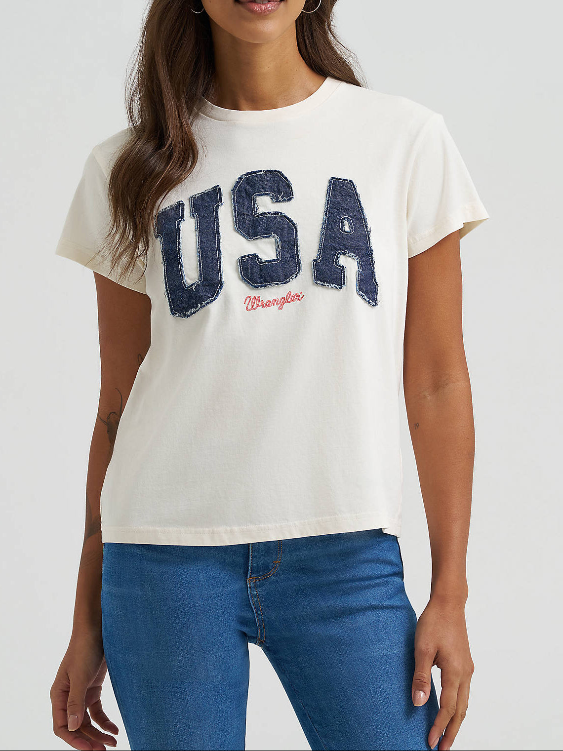 112375878 Wrangler Womens Denim USA Retro Regular Graphic Tee at boltranchstore.com in stock free shipping white short-sleeve t-shirt with a distressed navy blue 'USA' graphic and a small red 'Wrangler' logo underneath