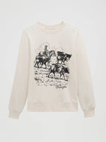 112379655 Wrangler Womens Cattle Drive Graphic Fleece Reg Pullover at boltranchstore.com in stock free shipping An off-white crewneck sweatshirt featuring a black line art graphic of a cowboy riding a horse with cattle, and the brand name 'Wrangler' printed below the graphic.