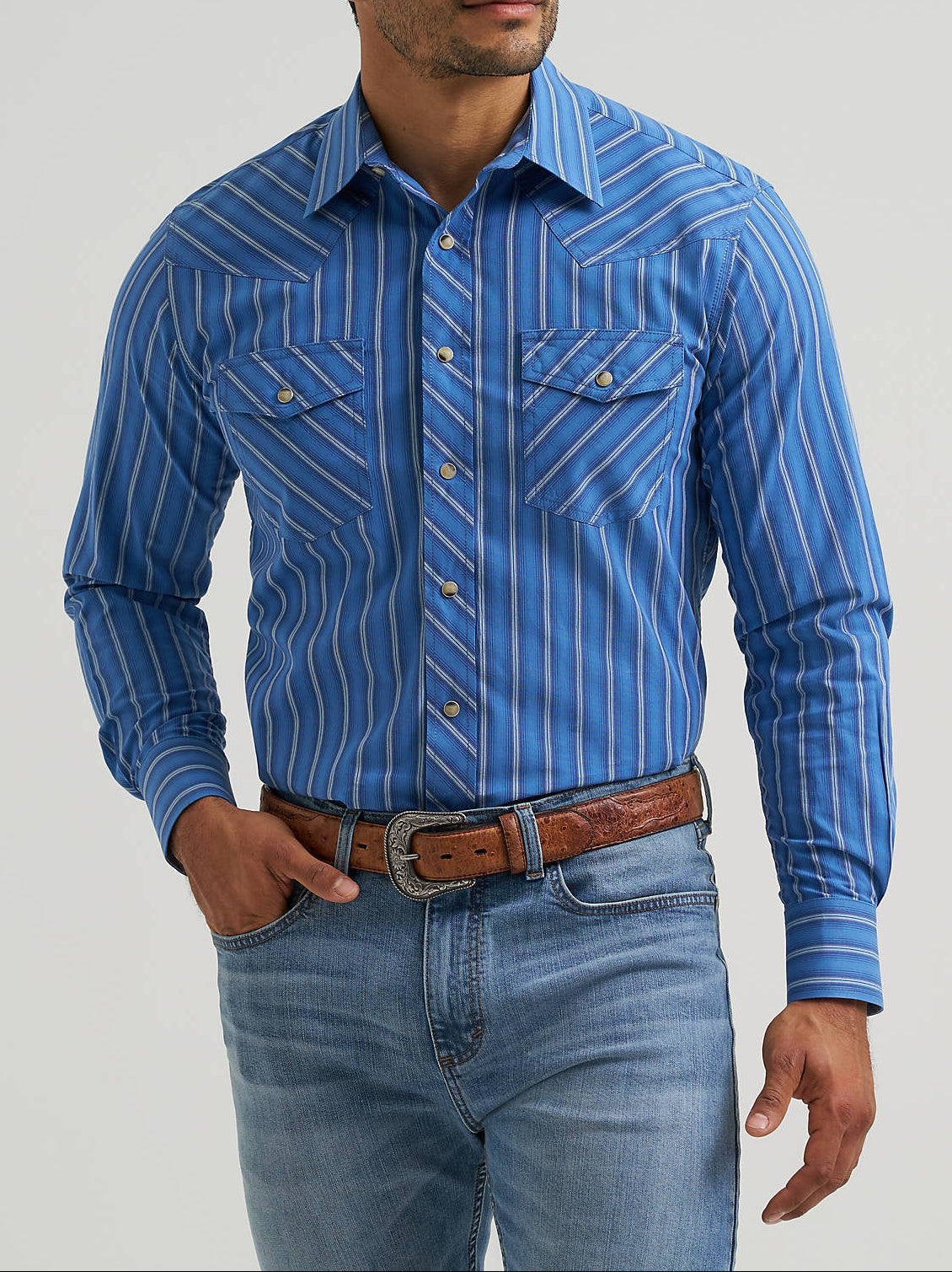 112381453 Wrangler Mens 20X Comp Advanced Western Snap Shirt at boltrachstore.com  in stock free shipping Man wearing a blue striped shirt 