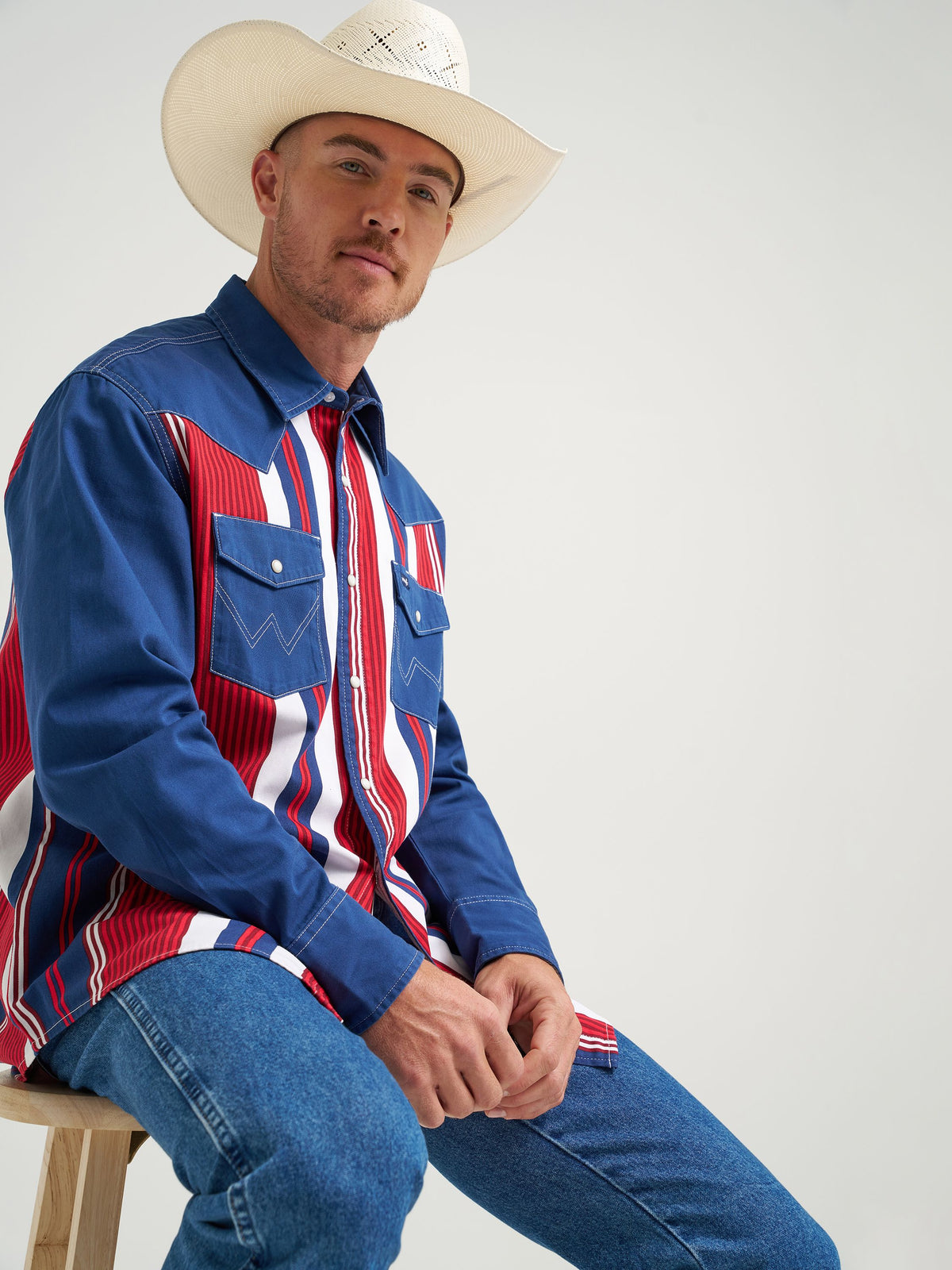 Wrangler Lone Star Brushpopper Western Snap Workshirt solid blue sleeves framing a striped body for rodeo nights