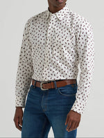 112381555 Wrangler Mens Cody Johnson One Pocket Button Down Shirt at boltranchstore.com in stock free shipping A man wearing a brown cowboy hat, a white long-sleeve button-up shirt with a small black repeating pattern