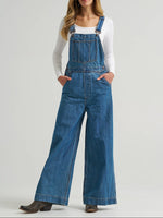 112382268 Wrangler Womens Retro Bailey Wide Leg Overalls at boltranchstore.com free shipping in stock Woman wearing blue denim overalls