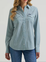 Wrangler Womens Performance Aria Shirt A long-sleeve western-style button-up shirt with thin vertical stripes in sage green and white, featuring two buttoned chest pockets
