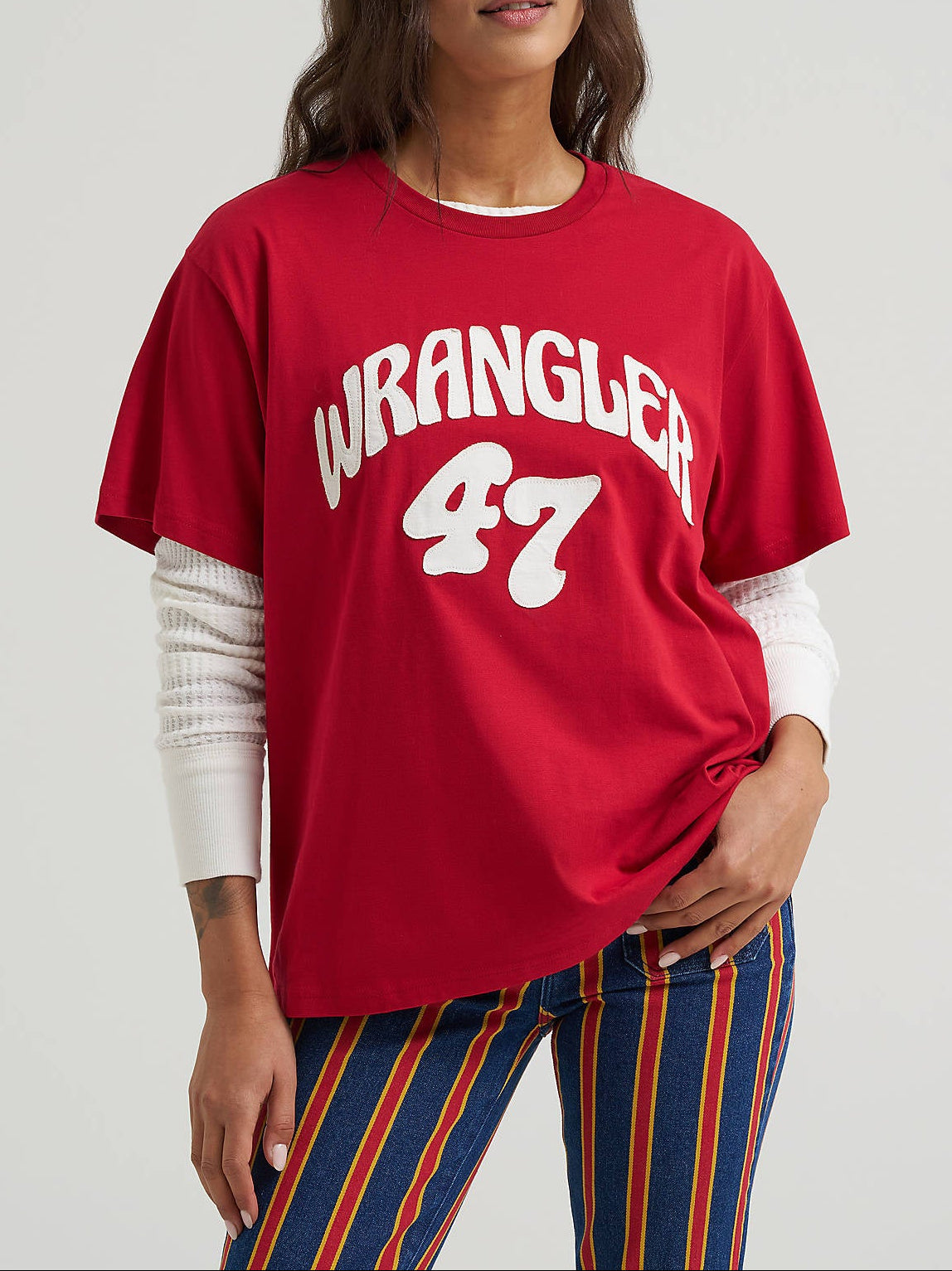112387183 Wrangler Womens Bubble Girlfriend Graphic Tee at boltranchstore.com in stock free shipping A woman modeling a red Wrangler 47 graphic t-shirt 