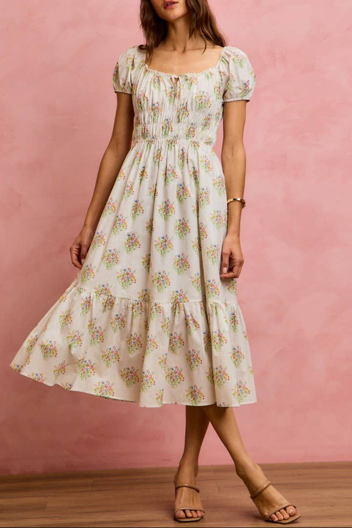 white dress with floral pattern pink yellow blue green puff sleeve doen dupe smocked waist tie boltranchstore.com