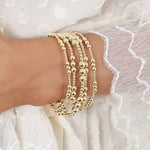 enewton Joy Gold 4mm Bracelet layered in an all gold bracelet stack for everyday western fashion