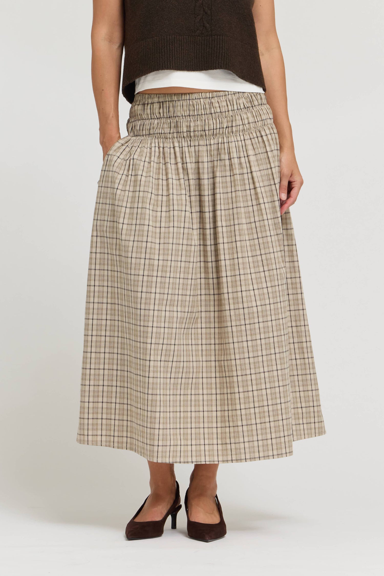 A comfortable womens Patricia Plaid Smocked midi Skirt in two colors a cream plaid and a dark brown chocolate plaid perfect for a western style casual outfit