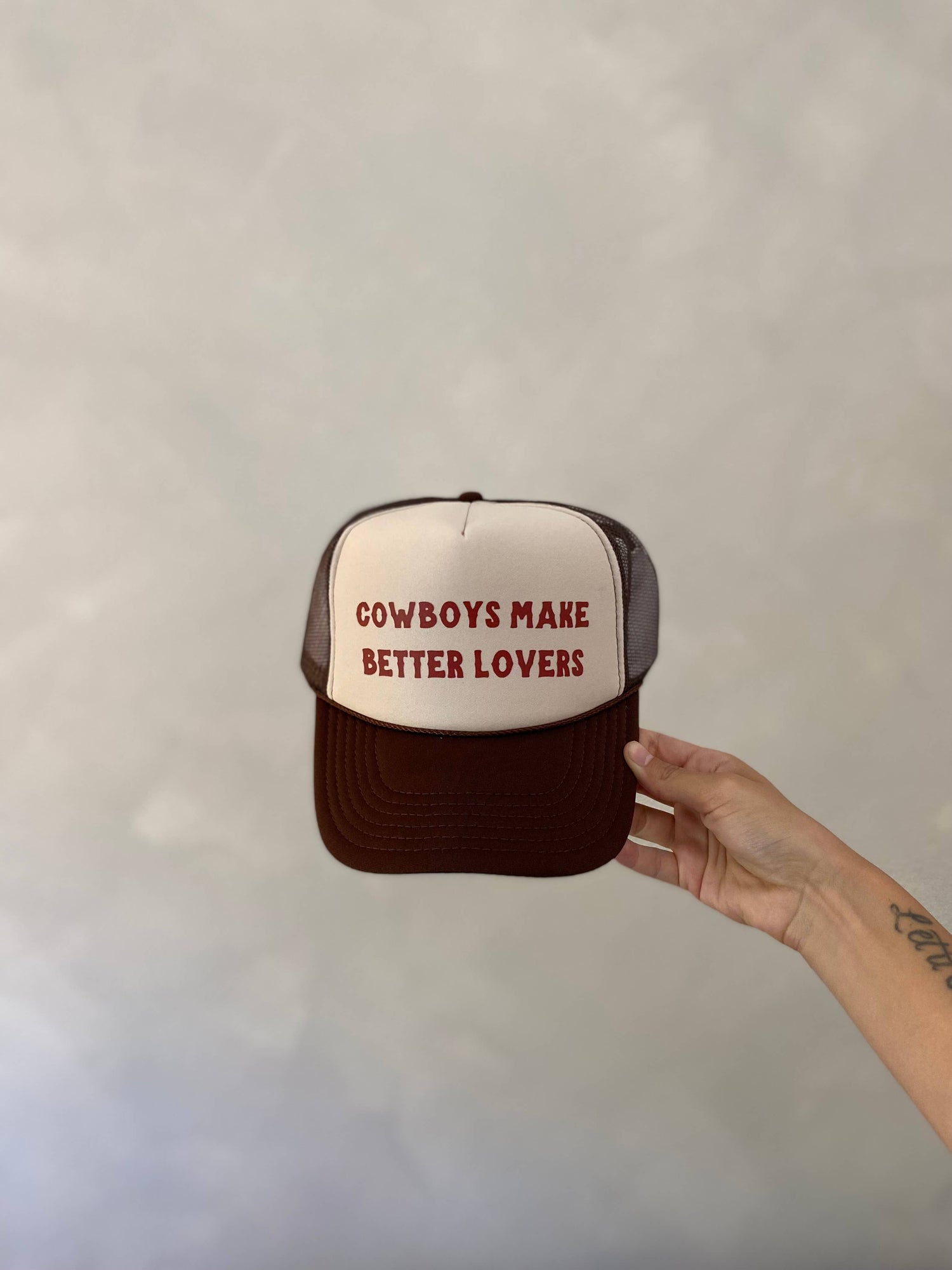 Cowboys Make Better Lovers Trucker hat