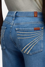 7 For All Mankind Dojo in Slim Illusion Bluehaven zip fly with button closure and whiskering through the thighs ranch wear