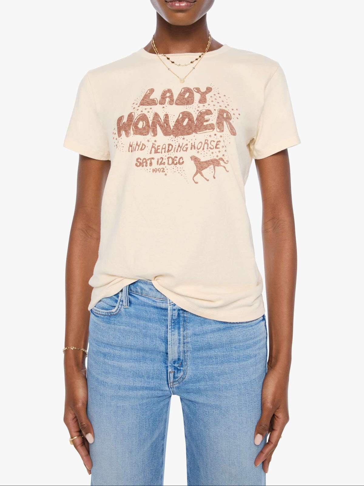 8231-1607 Mother The Boxy Goodie Goodie at boltranchstore.com in stock free shipping lady wonder horse shirt womens Woman wearing a beige t-shirt with text and graphics,