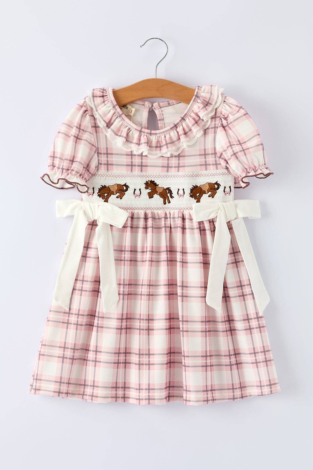 plaid dress with ruffle collar lace collar pink black and cream plaid cream bows smocked detail horse and horseshoe embroider puff sleeve and ruffle sleeve boltranchstore.com free shipping
