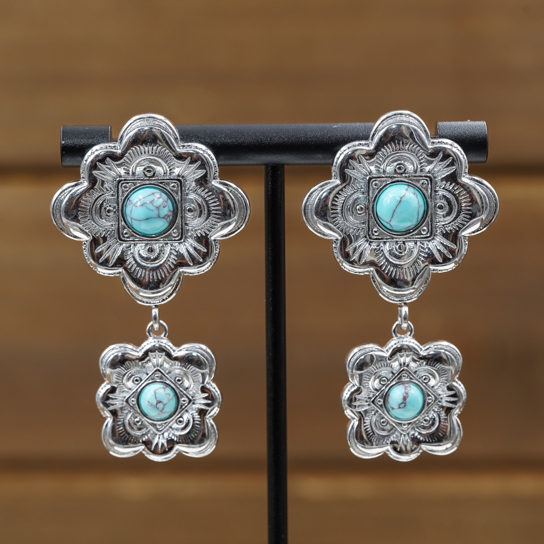 Antler Rings The Eloise Drop Earrings at boltranchstore.com in stock free shipping A pair of silver-toned drop earrings with ornate floral filigree tops and bottoms and round turquoise-colored stone centers, 