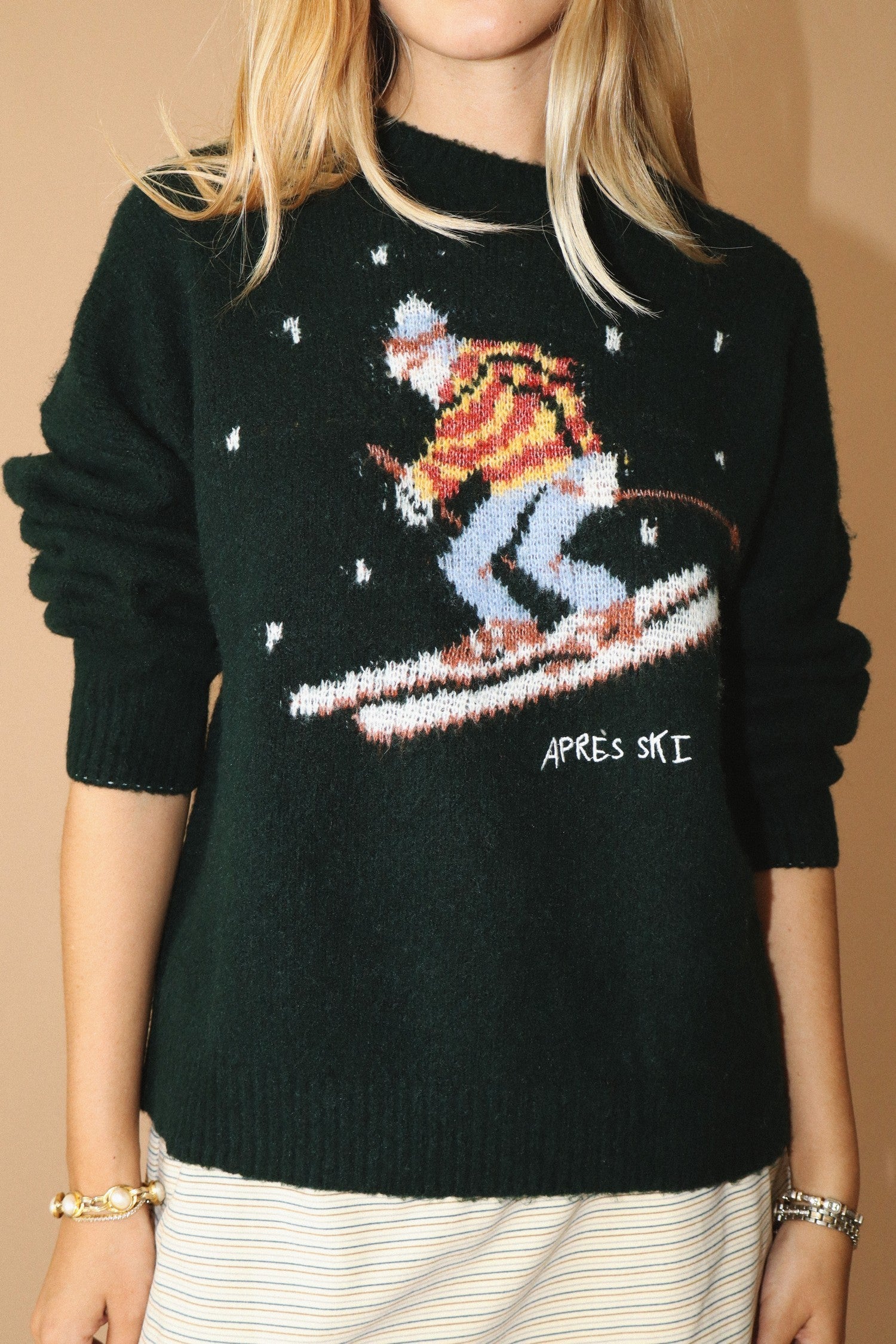 Apres Ski Vintage Skier Sweater in deep forest with a knitted in skiier on a dark forest background at boltranchstore.com