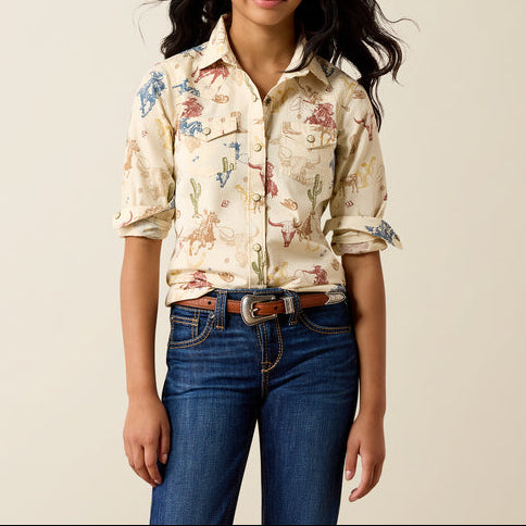 Ariat Girls Ranch Tale Western Snap Shirt at boltranchstore.com in stock free shipping A young woman modeling a cream-colored  long sleeve button-up shirt with a colorful western-themed print