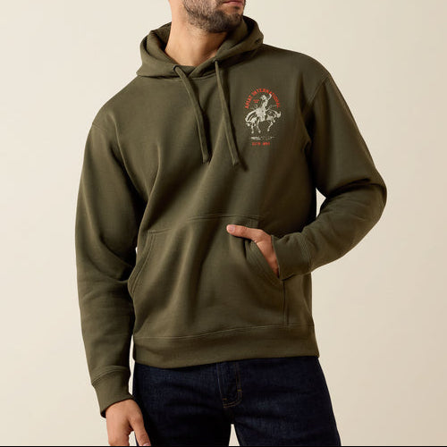 Ariat Mens International Rodeo Hoodie at boltranchstore.com in stock free shipping A man wearing an olive green pullover hoodie with a graphic print on the left chest