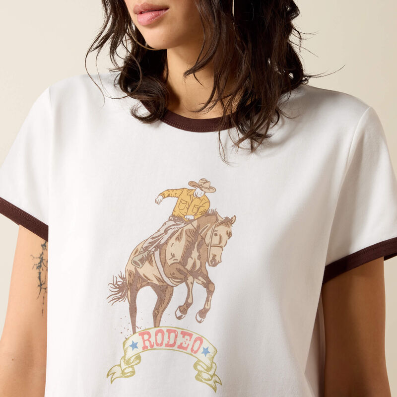 Ariat Womens Sundance short sleeve T Shirt a throwback with a rodeo graphic and brown collar and cuffs available at boltranchstore.com
