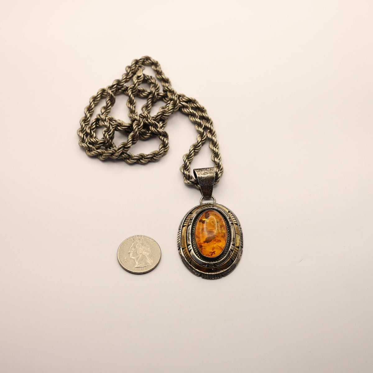 vintage necklace made by PA Smith showcases a stunning amber pendant set in sterling silver