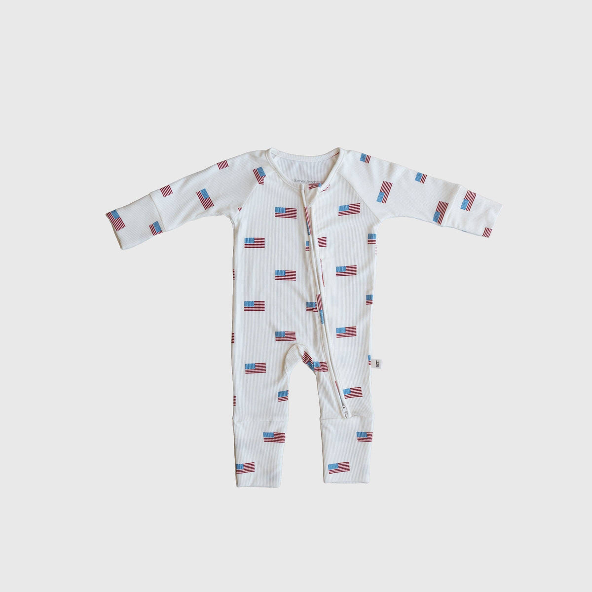 Bamboo Zip Pajamas Americana Ribbed shop at boltranchstore.com Baby onesie with flag pattern on a light gray background