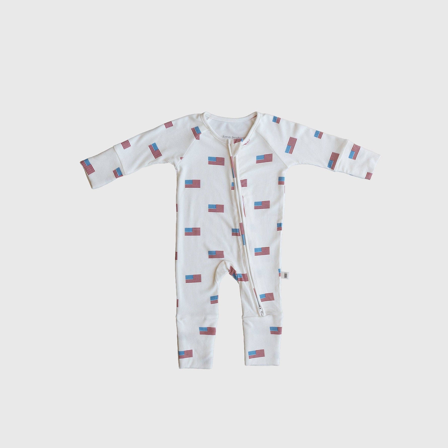 Bamboo Zip Pajamas Americana Ribbed shop at boltranchstore.com Baby onesie with flag pattern on a light gray background