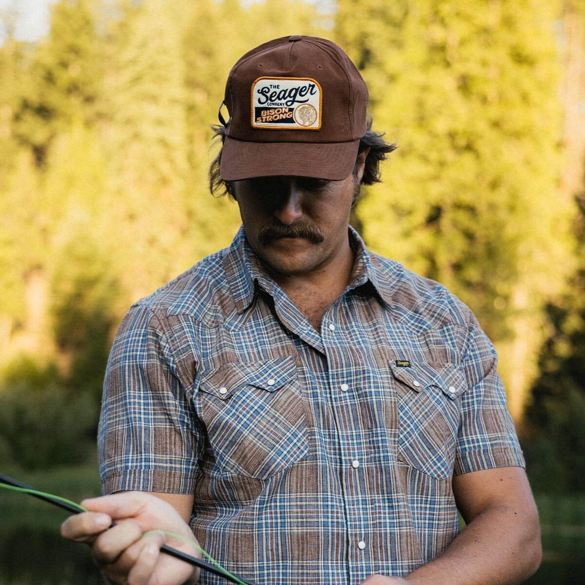 Seager Bison Waxed Snapback Brown workwear cap styled with canvas and denim Park City