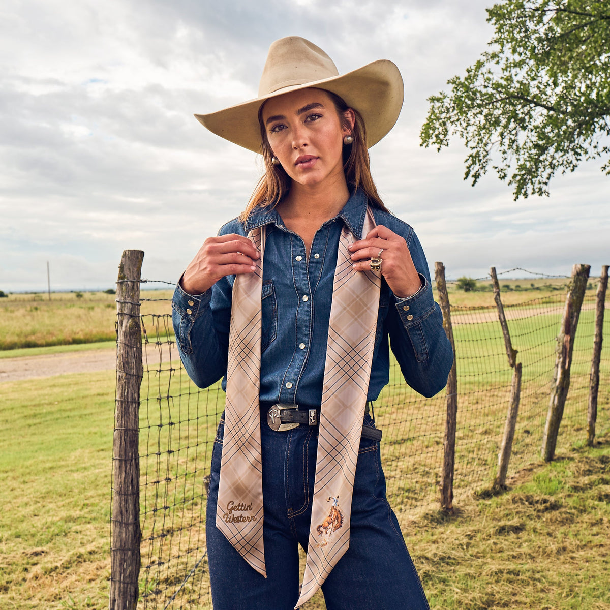 Fringe Scarves Boli Gettin Western Tan Blue Plaid tied under the collar of a western jacket western fashion