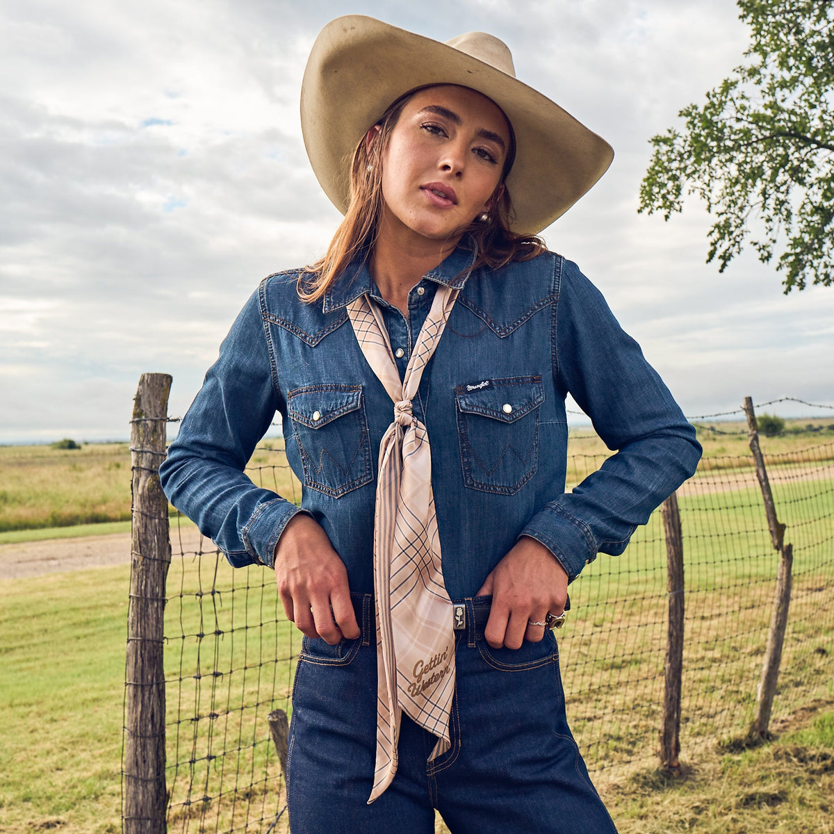 Fringe Scarves Boli Gettin Western Tan Blue Plaid looped through belt loops as a western belt ranch wear