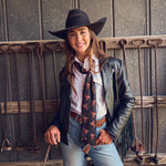 Fringe Scarves Boli Preppy Saddle Black Brown tied as an oversized bow at the collar western fashion