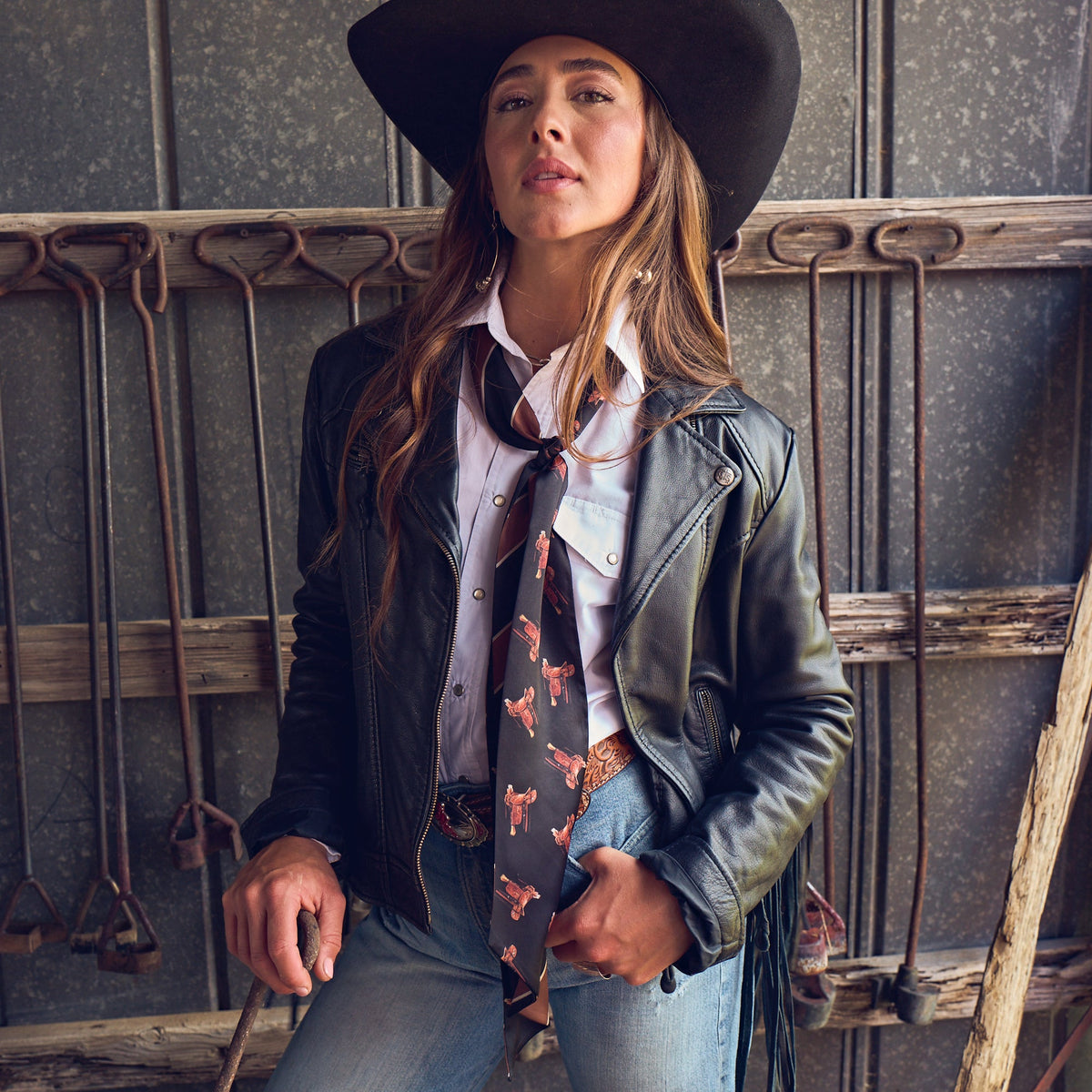 Fringe Scarves Boli Preppy Saddle Black Brown wrapped around a cowboy hat as a hatband Park City