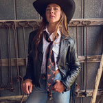 Fringe Scarves Boli Preppy Saddle Black Brown wrapped around a cowboy hat as a hatband Park City