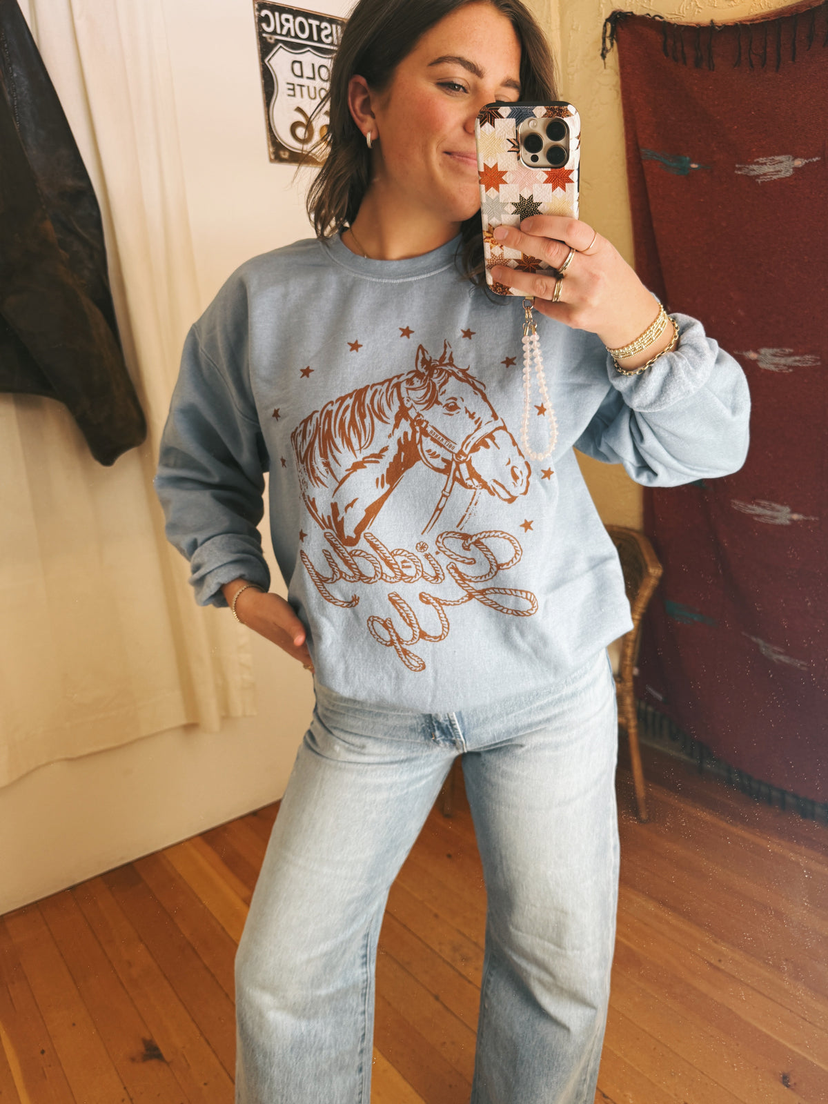 Bolt Ranch Giddy Up Crewneck in a dusty blue with horse logo at boltranchstore.com