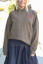 Bolt Ranch Good Luck Collegiate Hoodie in a leopard cheetah print with red embroidered stitching with a horseshoe