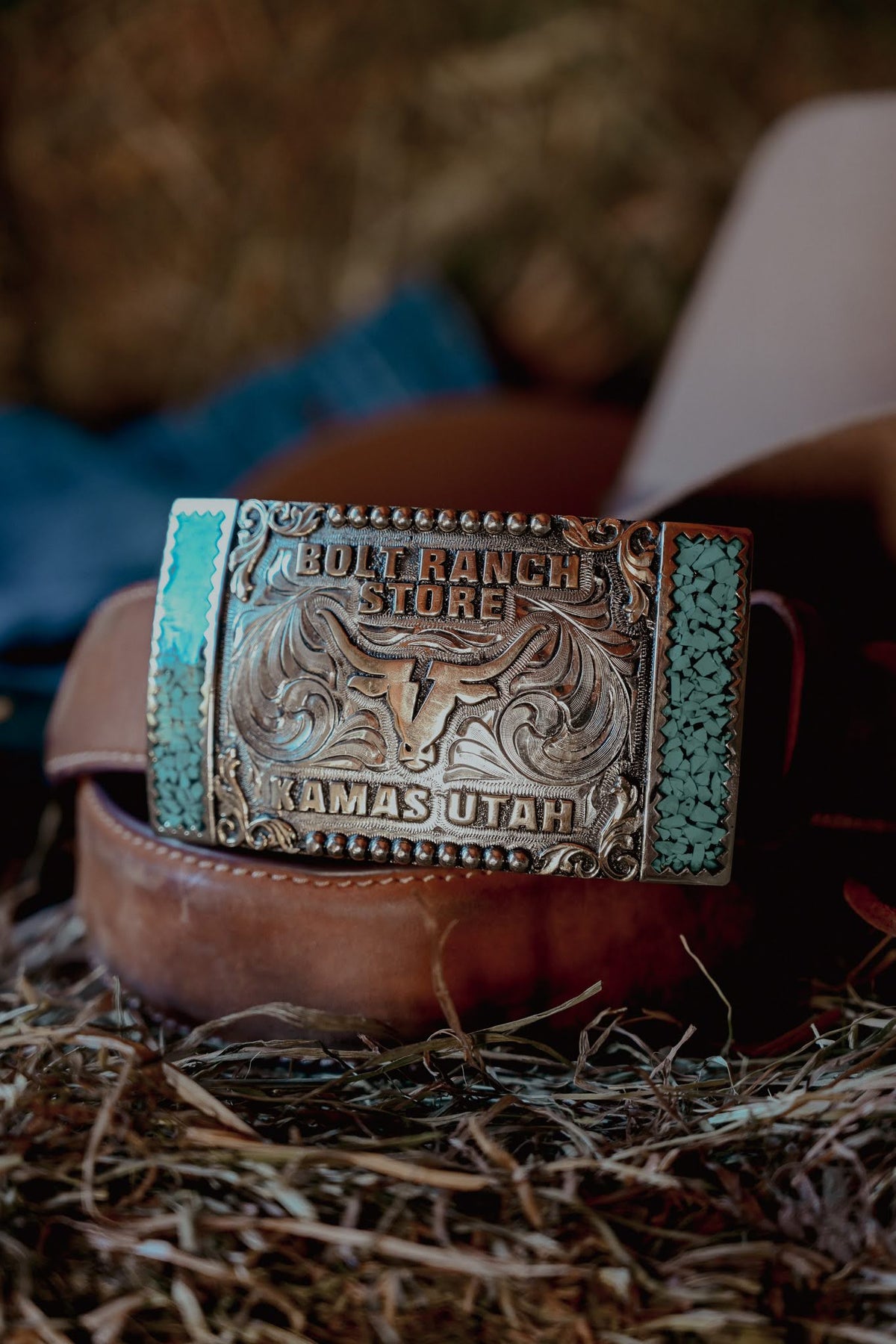 Bolt Ranch Turquoise Fenced Buckle with turquoise sides and scroll swirl design will bullhead bolt ranch store logo. limited edition buckle available now.