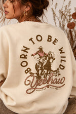 womens Born To Be Wild Crewneck cowboy crewneck with brown and pink yeehaw graphic that's popular this fall