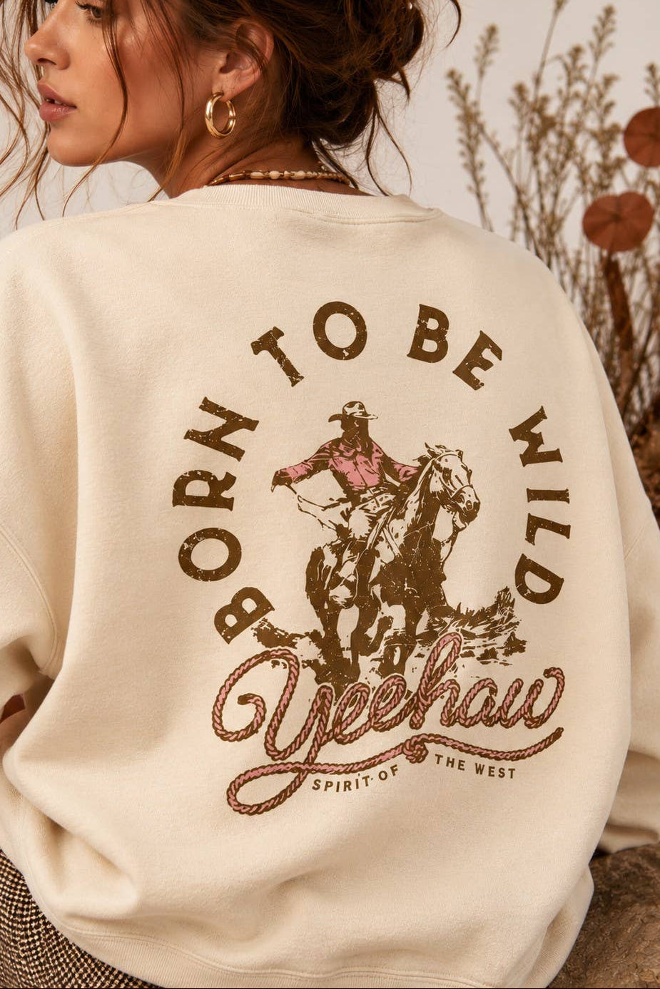 womens Born To Be Wild Crewneck cowboy crewneck with brown and pink yeehaw graphic that's popular this fall