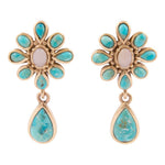 A pair of gold-tone drop earrings featuring a flower-shaped top with turquoise-blue stones and a central pale pink stone, with a teardrop-shaped turquoise-blue stone hanging below. Cactus Rose Pink Opal Blue Turquoise Golden Clip Earring at boltranchstore.com free shipping 