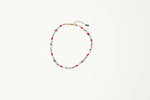 A delicate beaded necklace with alternating red and light blue beads shop at boltranchstore.com