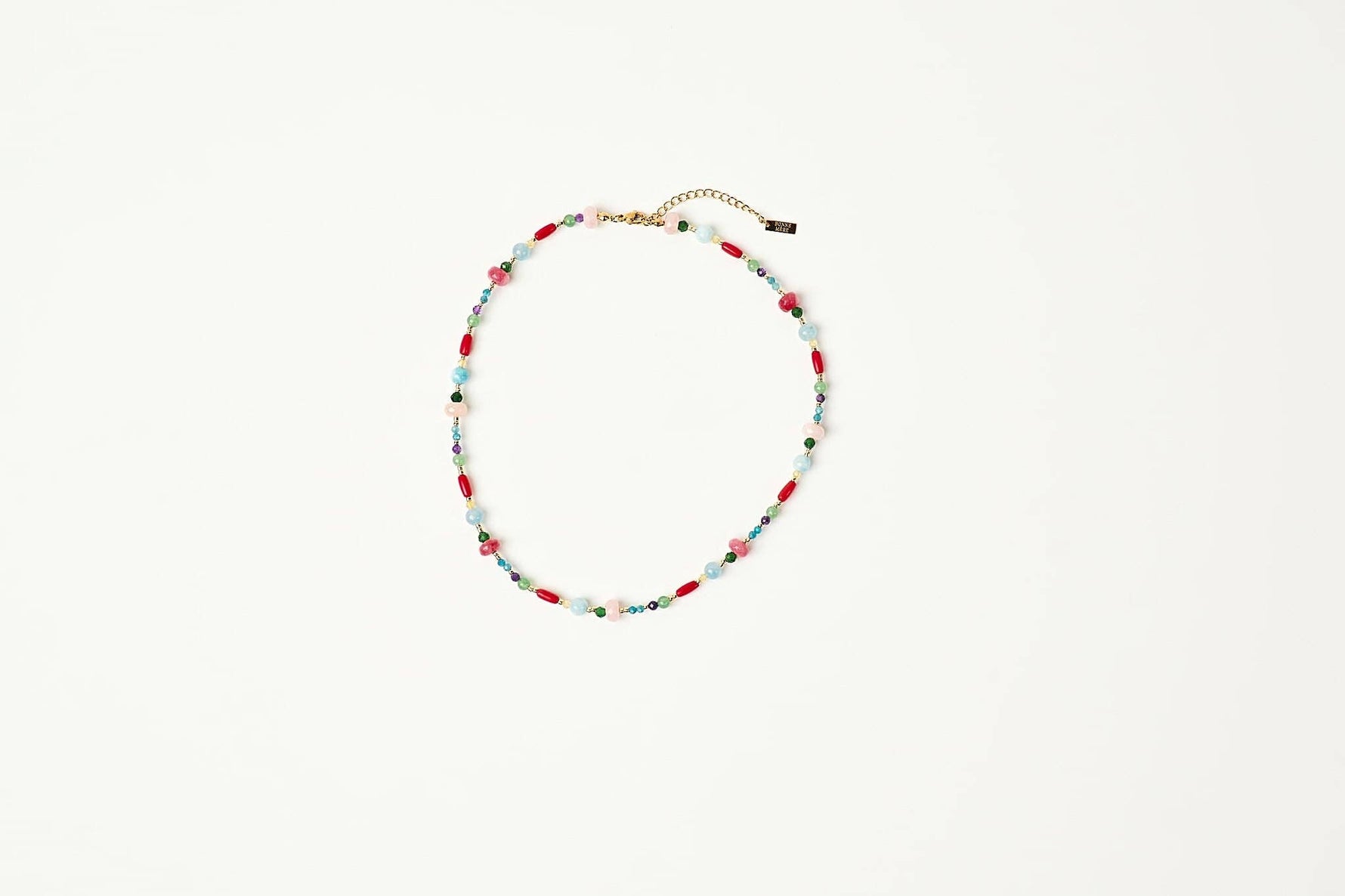 A delicate beaded necklace with alternating red and light blue beads shop at boltranchstore.com