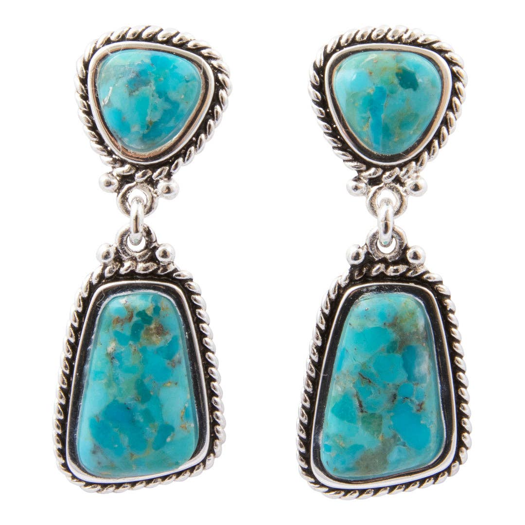 A pair of silver drop earrings featuring natural turquoise stones in a Southwestern style, with a small triangular top stone and a larger teardrop-shaped drop stone, set in oxidized silver with twisted rope borders. Double Blue Turquoise Silver Drop Earrings at boltranchstore.com