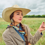 Fringe El Azteca Silk Scarf Chambray ties in a bow for a softer look western clothing