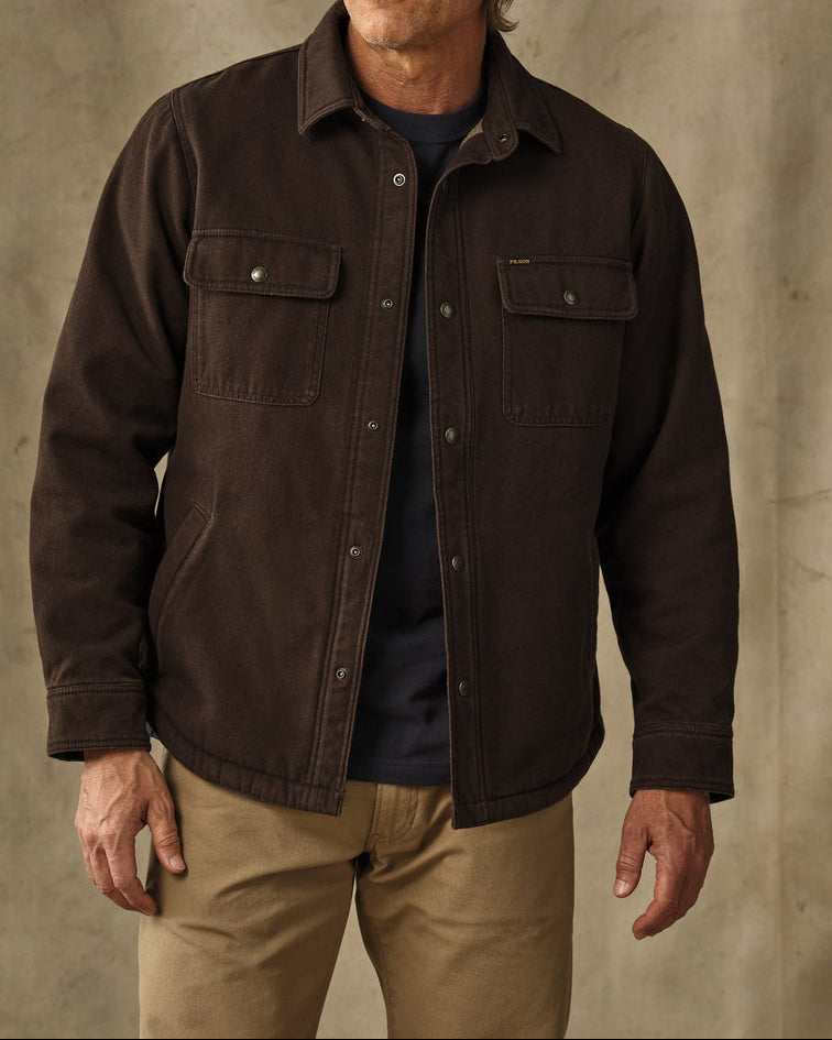 Canvas brown in a button up front, two front pockets sherpa lined 