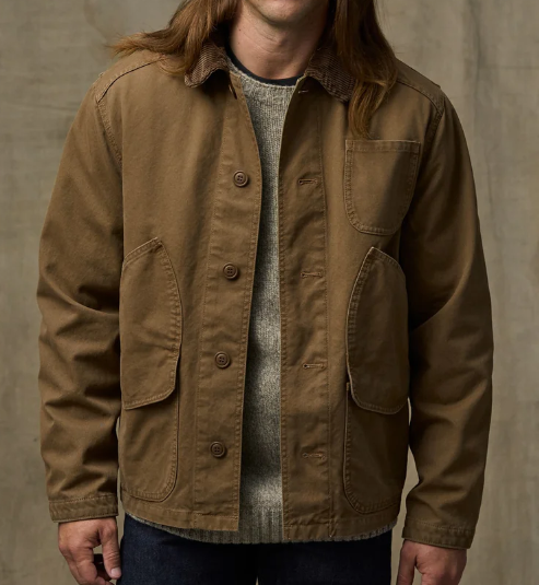 Filson Mens Canvas Outfitter Jacket in Kangaroo is a canvas button up coat with hand pockets and cargo pockets and a corduroy lined collar at boltranchstore.com